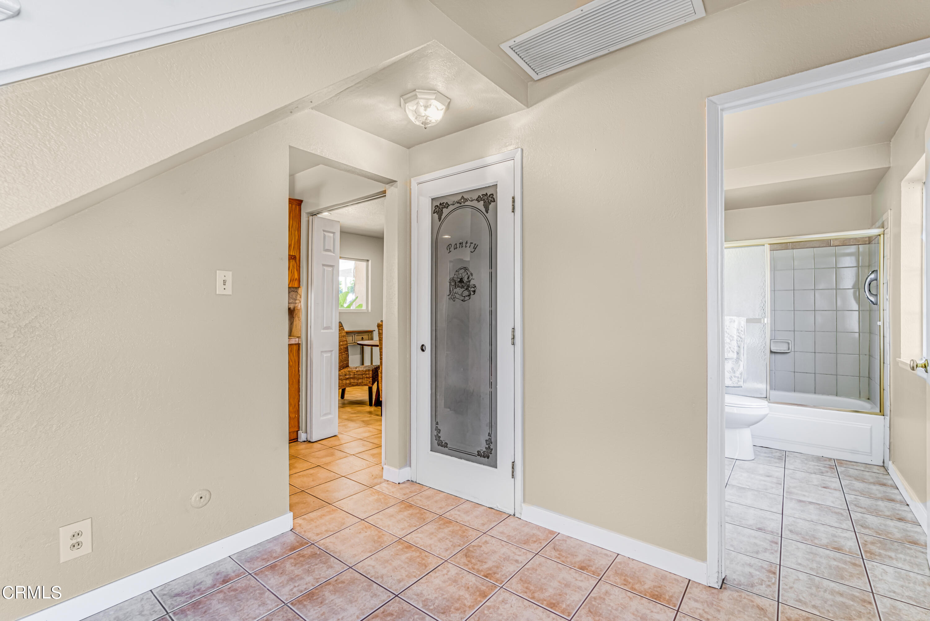 2810 Fitzgerald Road Simi Valley, CA 93065 - Photo 12 of 38 a view of a hallway with wooden floor and a bathroom