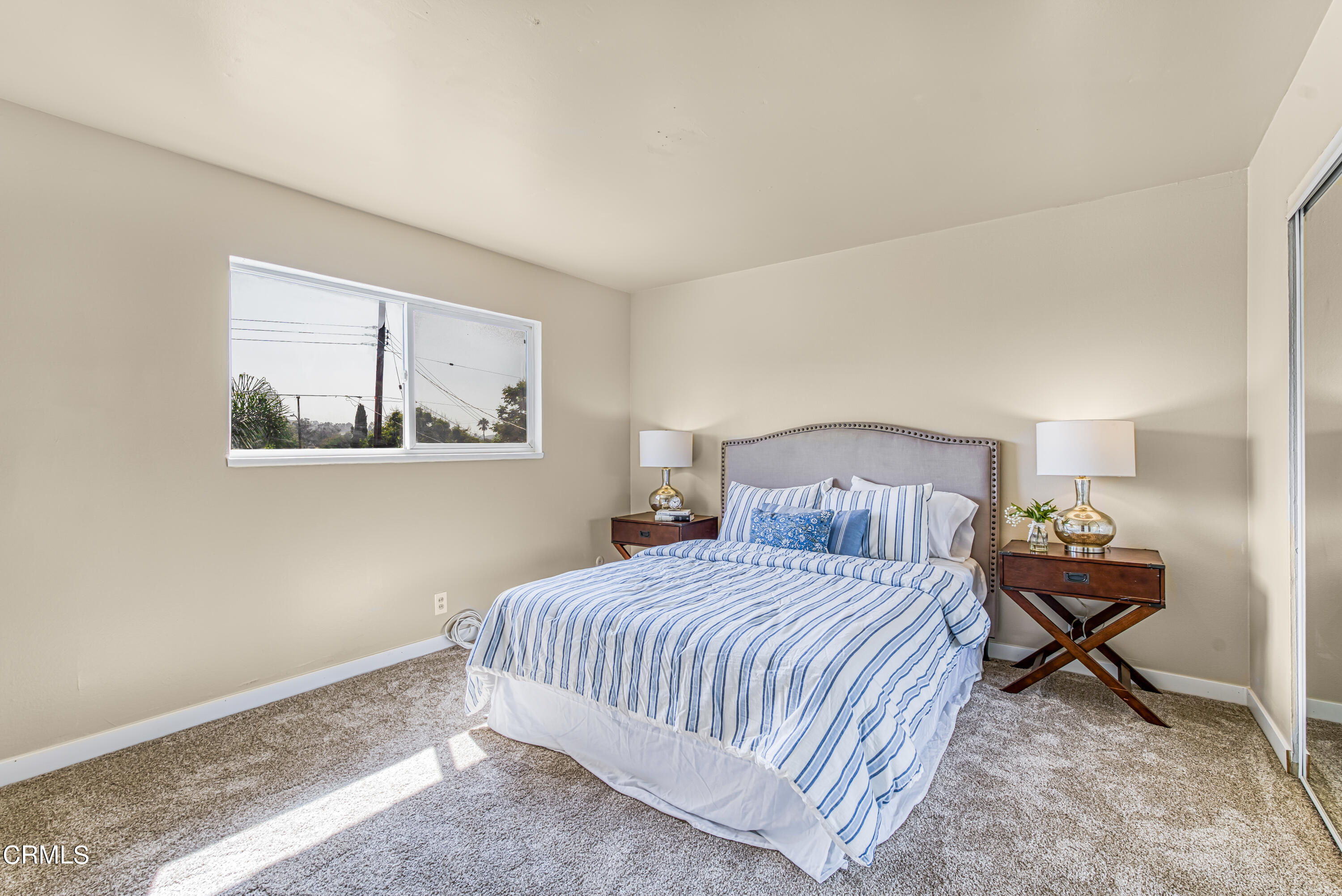 2810 Fitzgerald Road Simi Valley, CA 93065 - Photo 17 of 38 a bedroom with a bed and a window