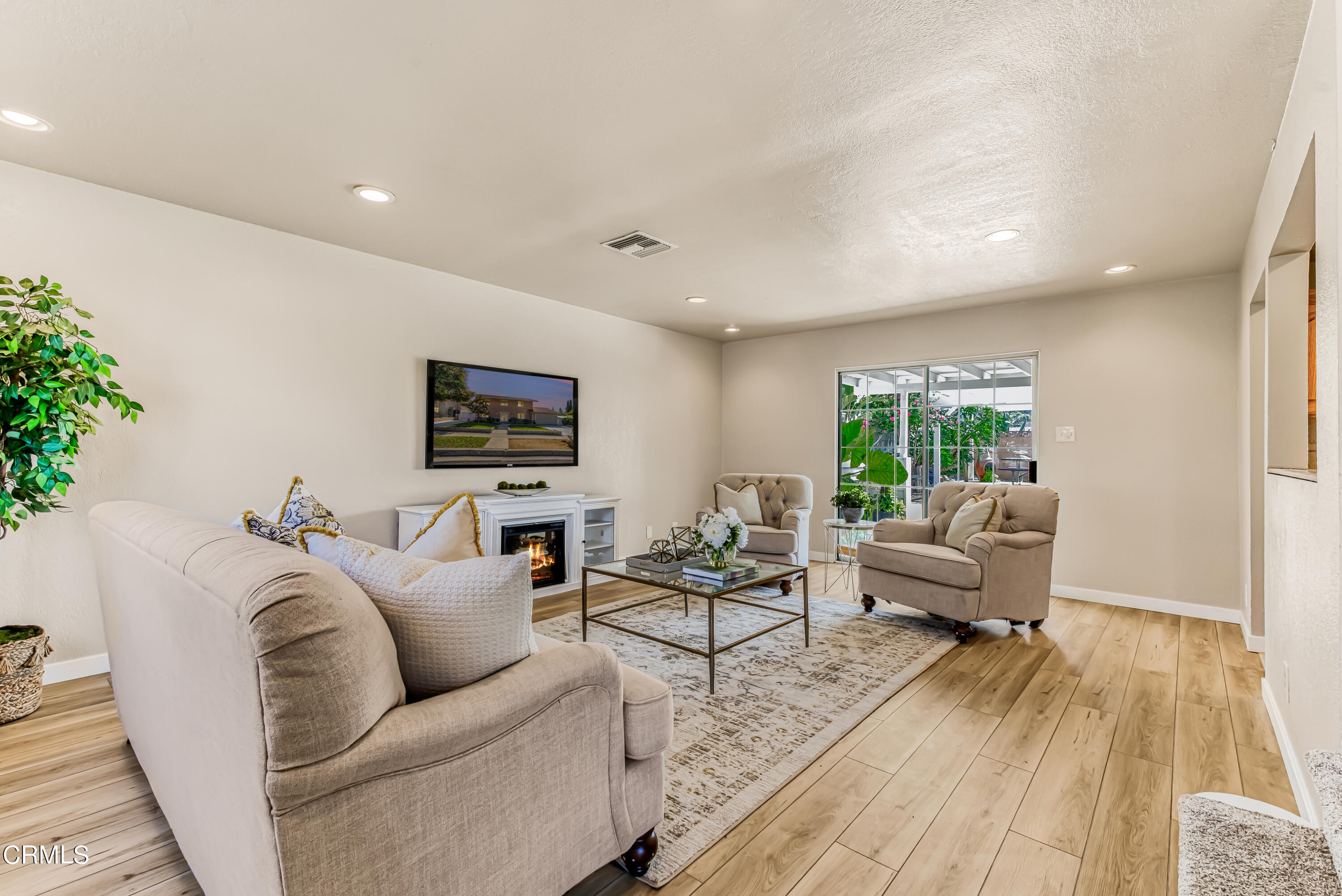 2810 Fitzgerald Road Simi Valley, CA 93065 - Photo 4 of 38 a living room with furniture and a wooden floor