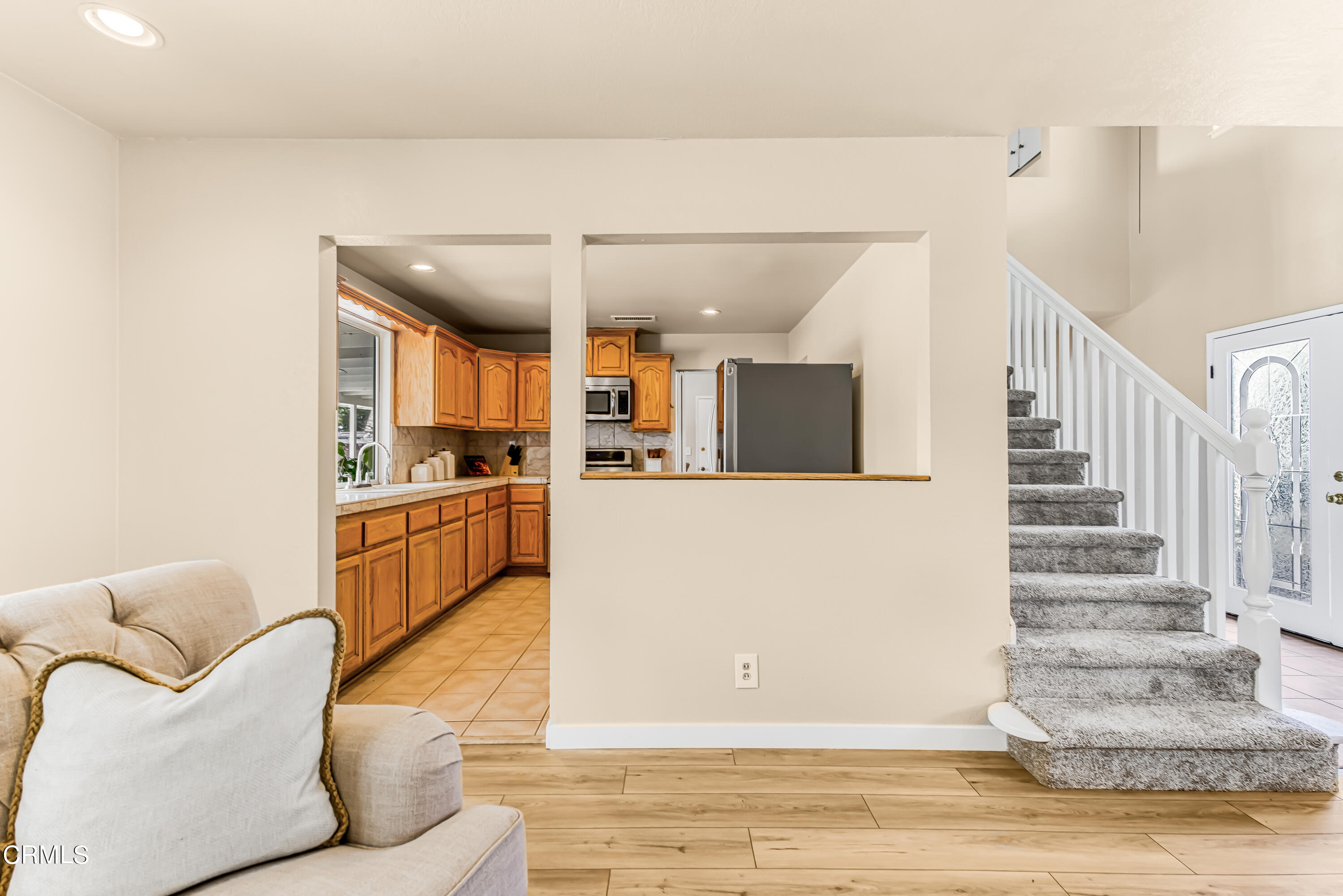 2810 Fitzgerald Road Simi Valley, CA 93065 - Photo 9 of 38 a living room with furniture and kitchen view