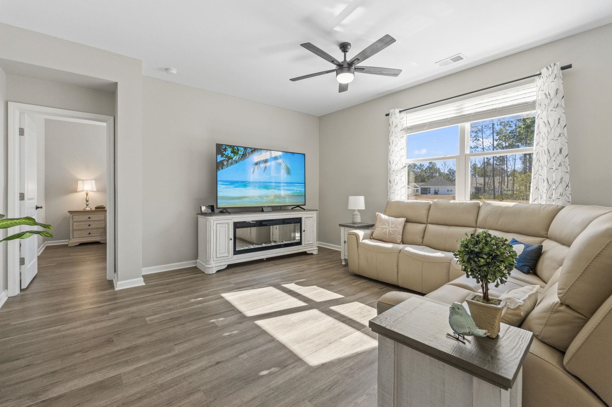 143 Ardeer Court Little River, SC 29566 - Photo 15 of 40 Living area featuring wood finished floors and ceiling fan