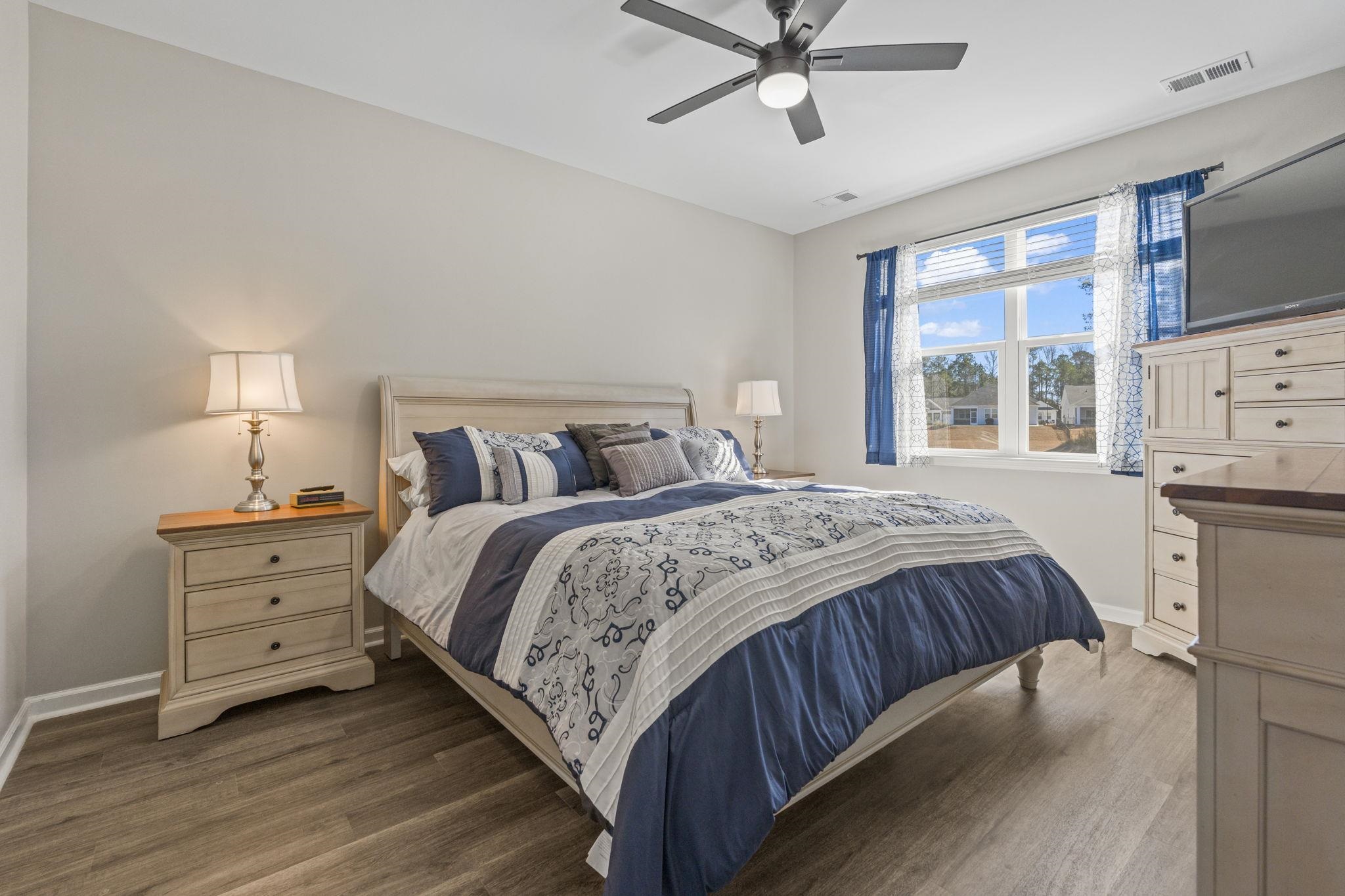 143 Ardeer Court Little River, SC 29566 - Photo 16 of 40 Bedroom with wood finished floors and ceiling fan