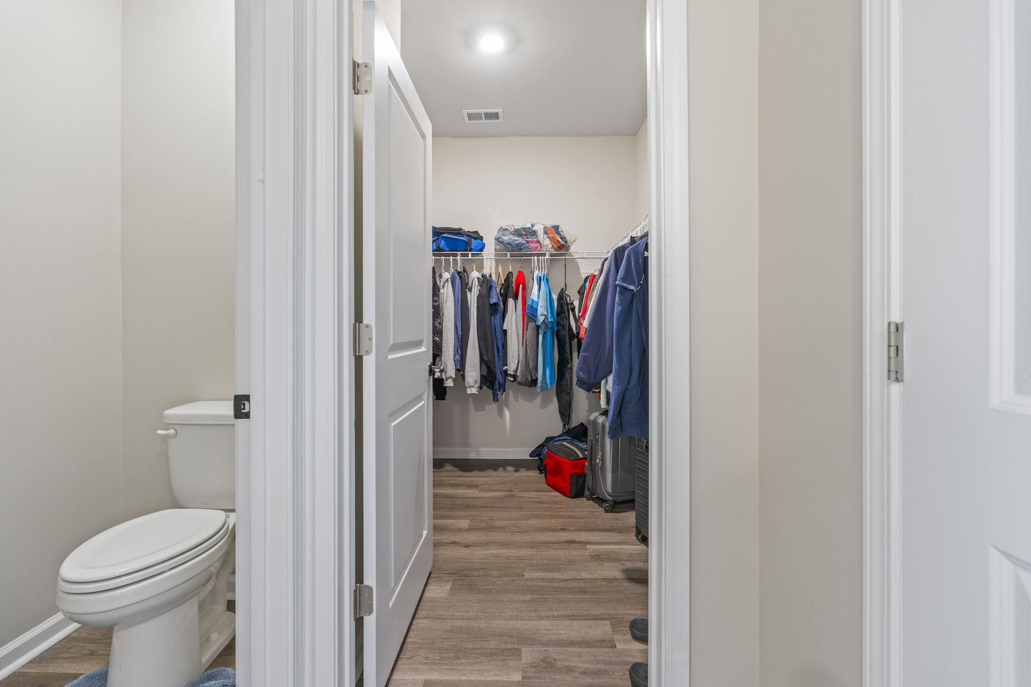 143 Ardeer Court Little River, SC 29566 - Photo 20 of 40 Bathroom featuring light wood-style floors and a walk in closet