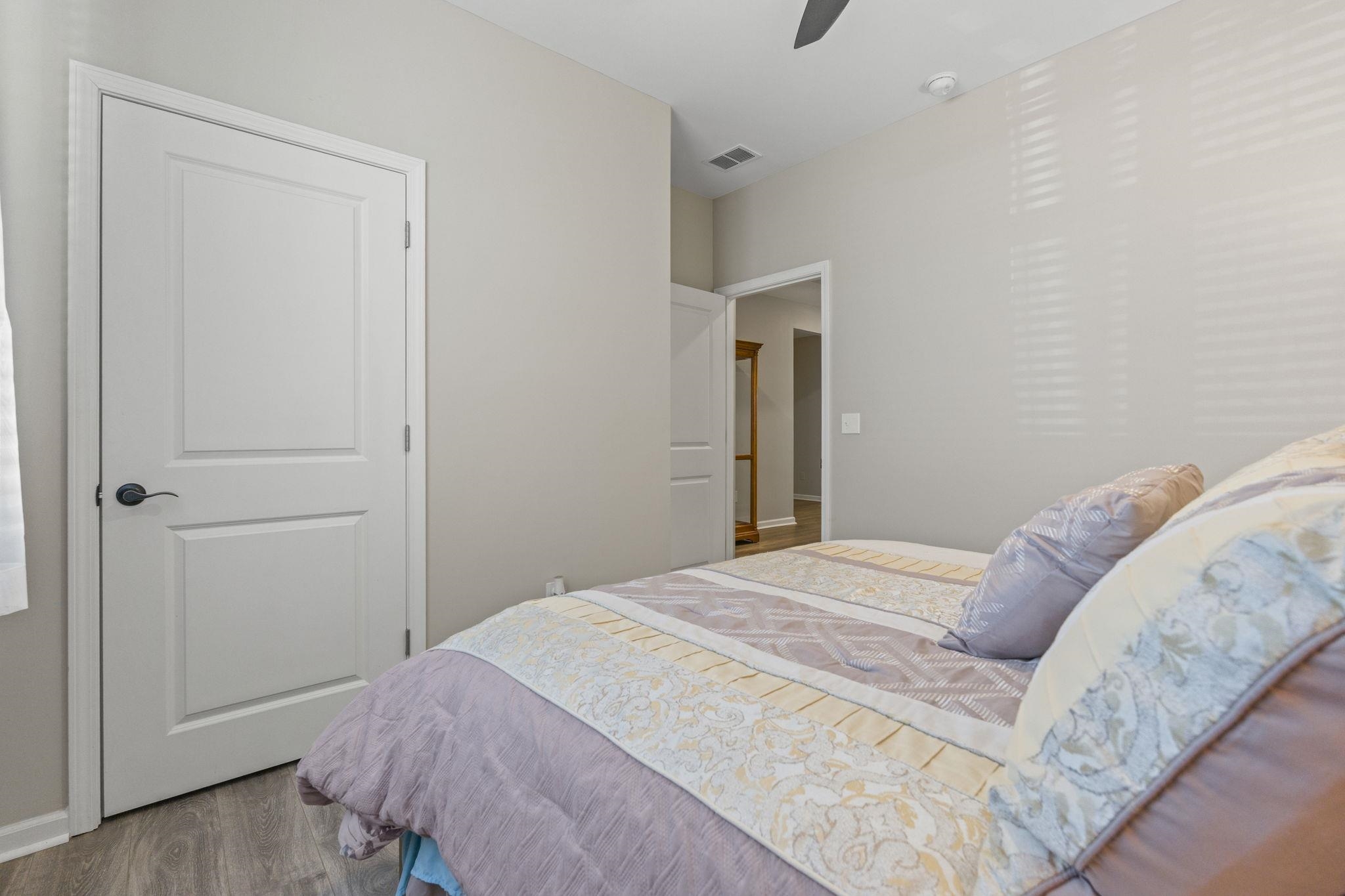 143 Ardeer Court Little River, SC 29566 - Photo 21 of 40 Bedroom featuring wood finished floors and a ceiling fan