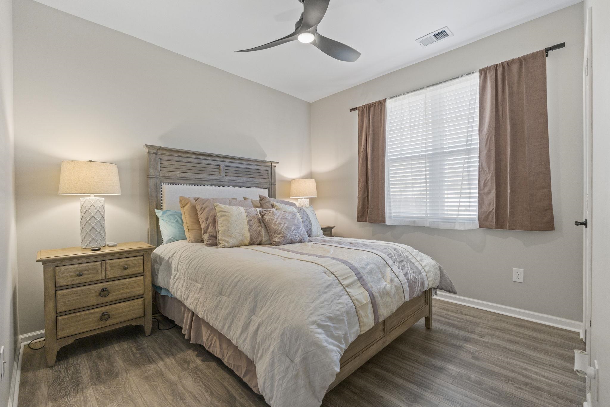 143 Ardeer Court Little River, SC 29566 - Photo 22 of 40 Bedroom with dark wood finished floors and a ceiling fan