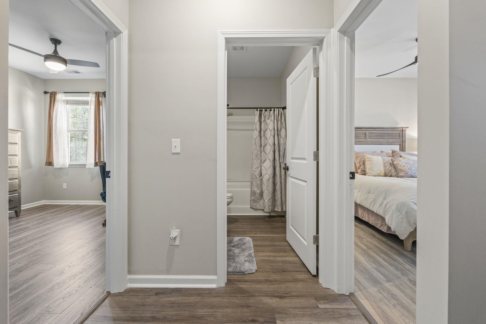 143 Ardeer Court Little River, SC 29566 - Photo 27 of 40 Hall with dark wood-style flooring and baseboards