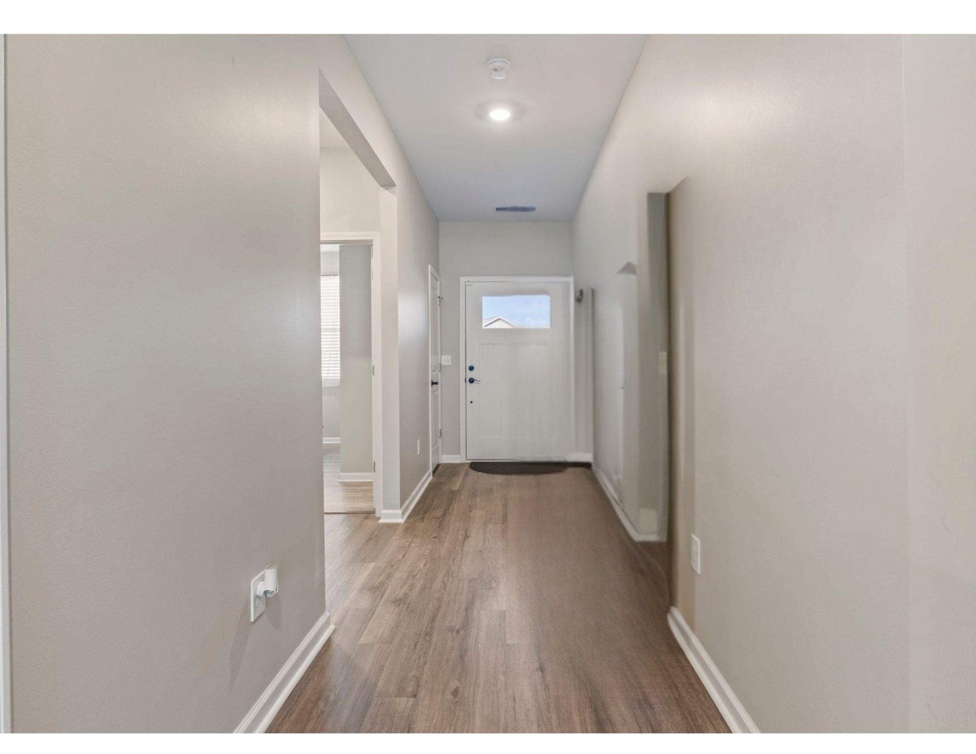 143 Ardeer Court Little River, SC 29566 - Photo 28 of 40 Entryway featuring baseboards and wood finished floors