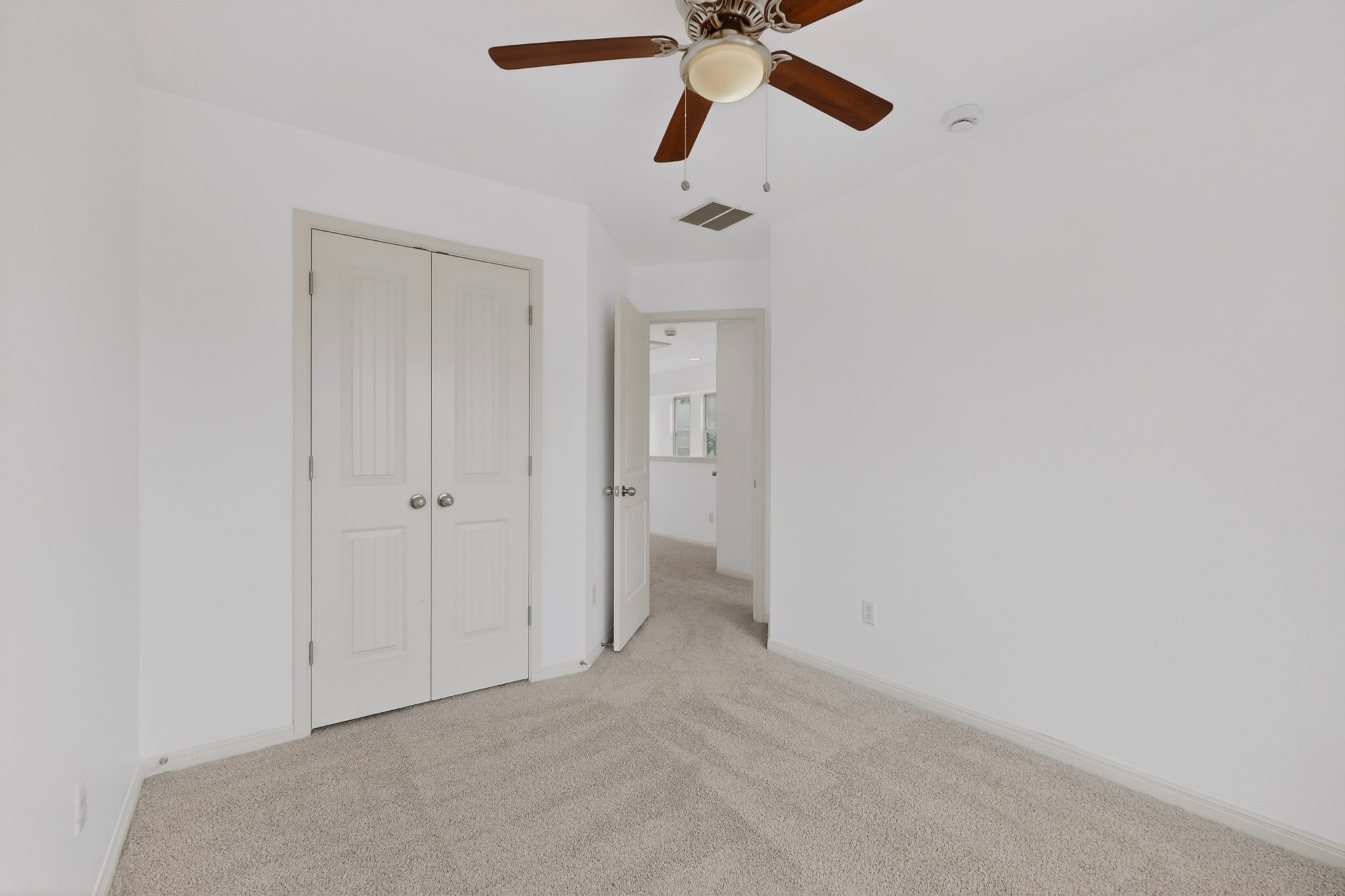 4619 Inicio Lane Austin, TX 78725 - Photo 22 of 32 a view of an empty room and chandelier fan
