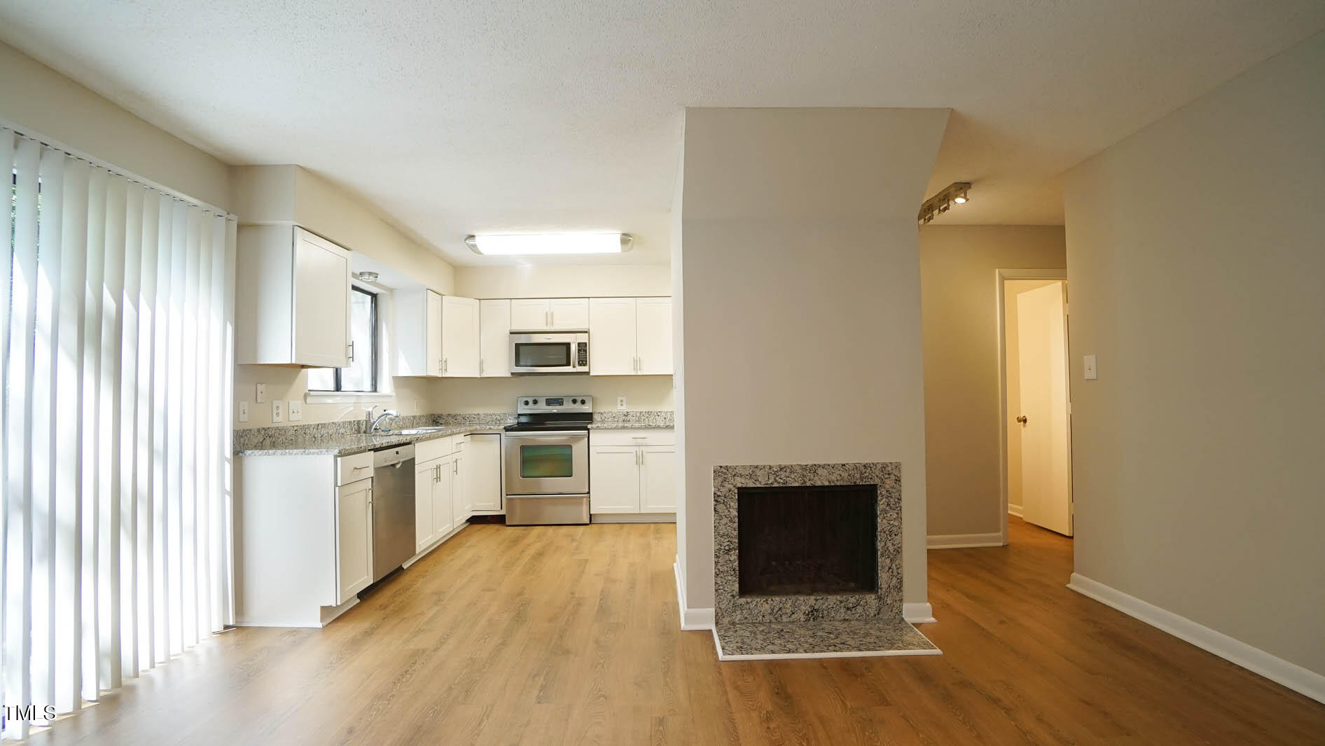 1020 North Bend Drive Raleigh, NC 27609 - Photo 16 of 50 a kitchen with a refrigerator and a stove top oven