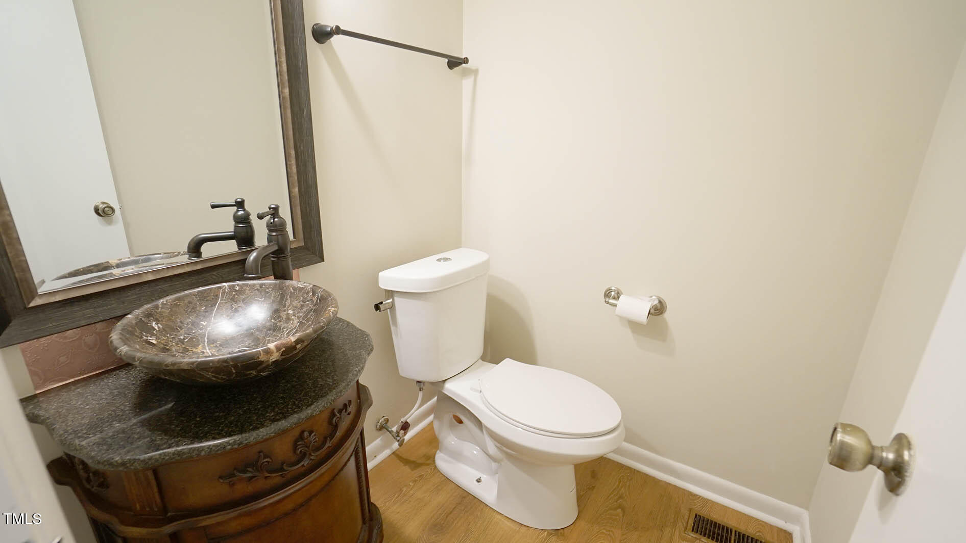1020 North Bend Drive Raleigh, NC 27609 - Photo 24 of 50 a bathroom with a toilet and a mirror