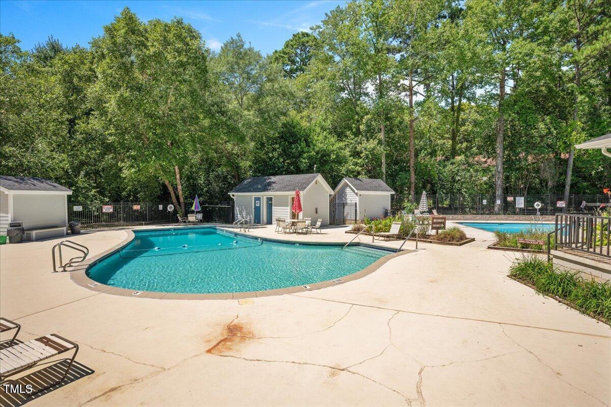 1020 North Bend Drive Raleigh, NC 27609 - Photo 3 of 50 a view of a swimming pool with a patio