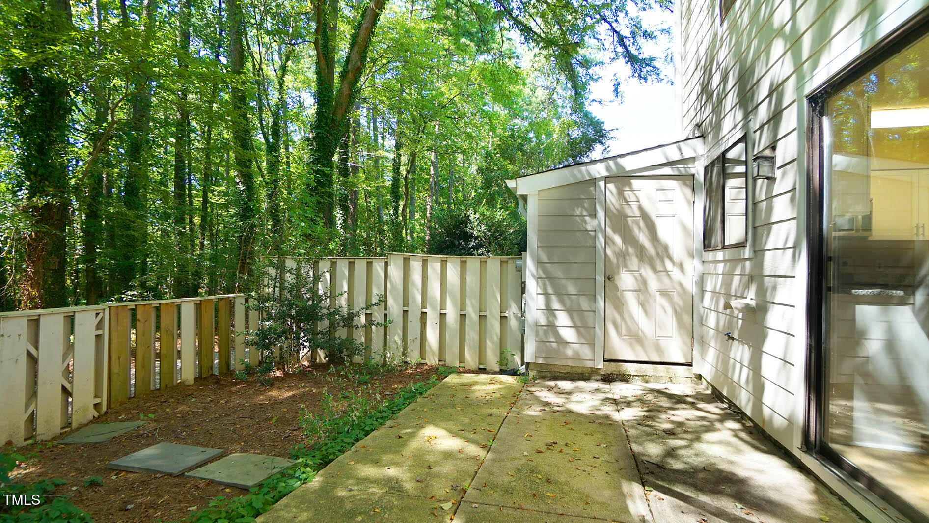 1020 North Bend Drive Raleigh, NC 27609 - Photo 46 of 50 a view of a house with backyard and sitting area