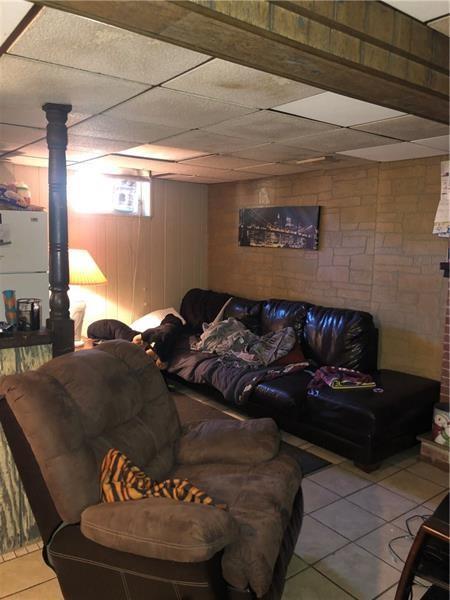 474 Oregon Avenue Rochester, PA 15074 - Photo 14 of 16 a bed sitting in a bedroom next to a window