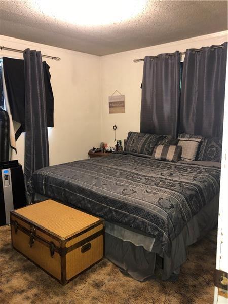 474 Oregon Avenue Rochester, PA 15074 - Photo 8 of 16 a bedroom with a bed and furniture