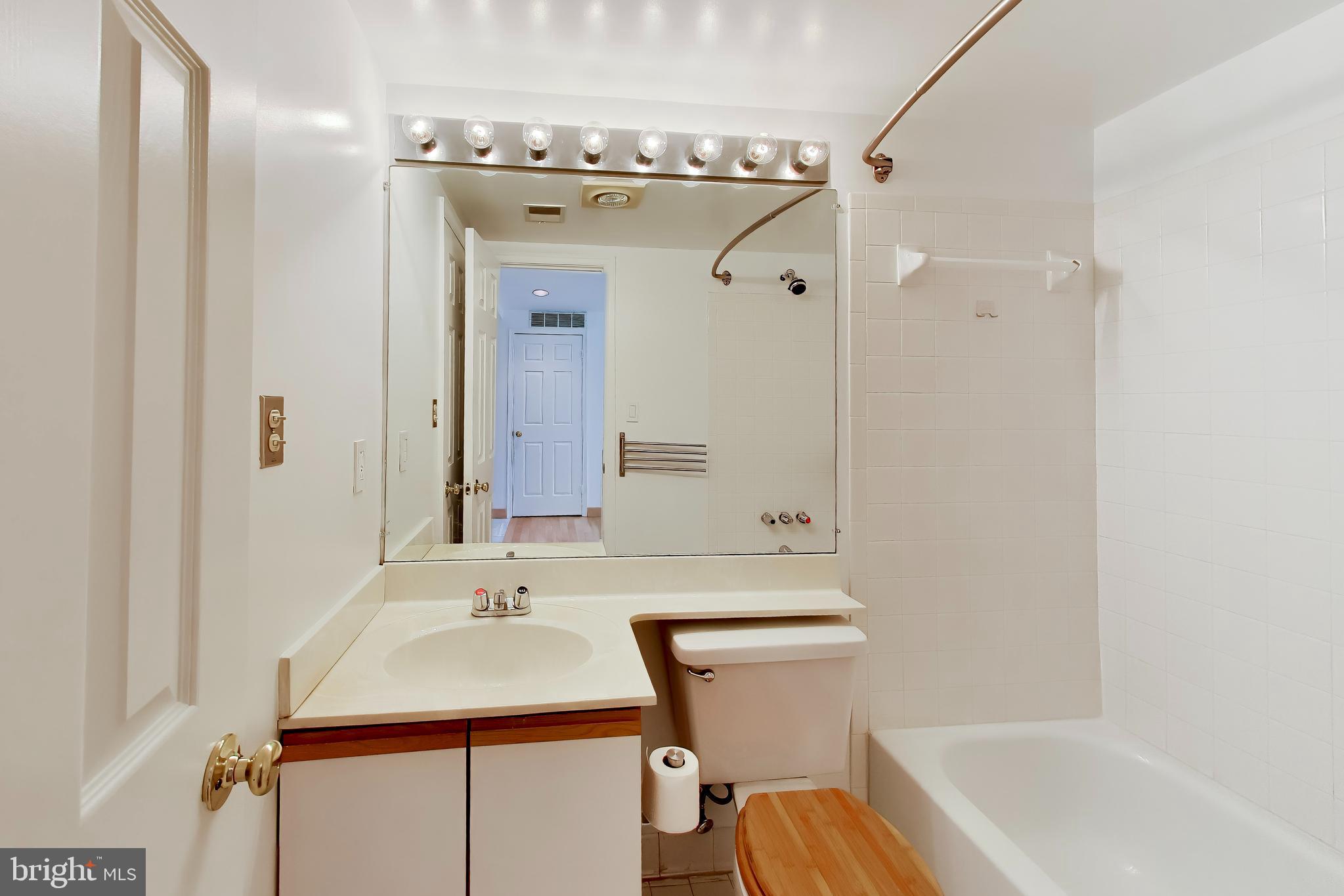 1920 S Street Northwest, Unit 403 Washington, DC 20009 - Photo 9 of 13 a bathroom with a sink a toilet and a bathtub