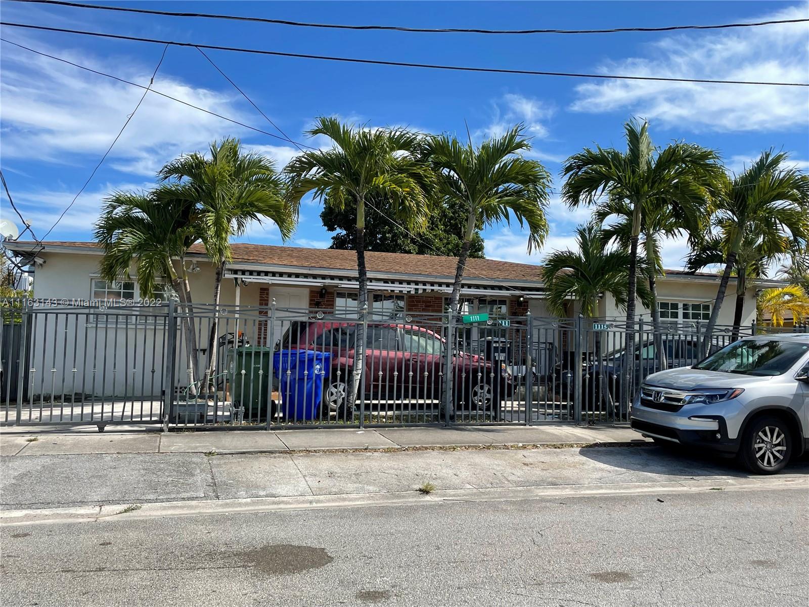a view of a car park in front of a house