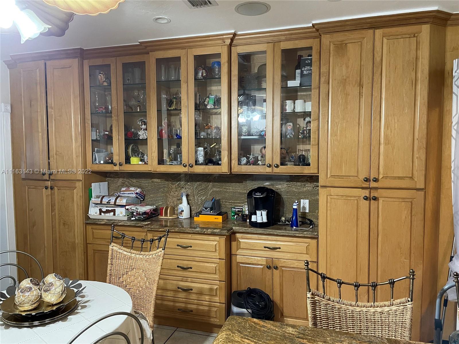 1111 Southwest 11th Avenue Miami, FL 33129 - Photo 13 of 28 a kitchen with a refrigerator and cabinets