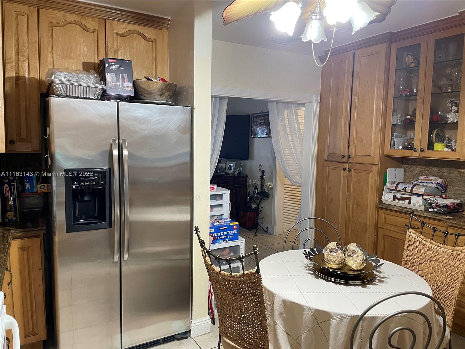 1111 Southwest 11th Avenue Miami, FL 33129 - Photo 14 of 28 a kitchen with stainless steel appliances granite countertop a refrigerator and a stove