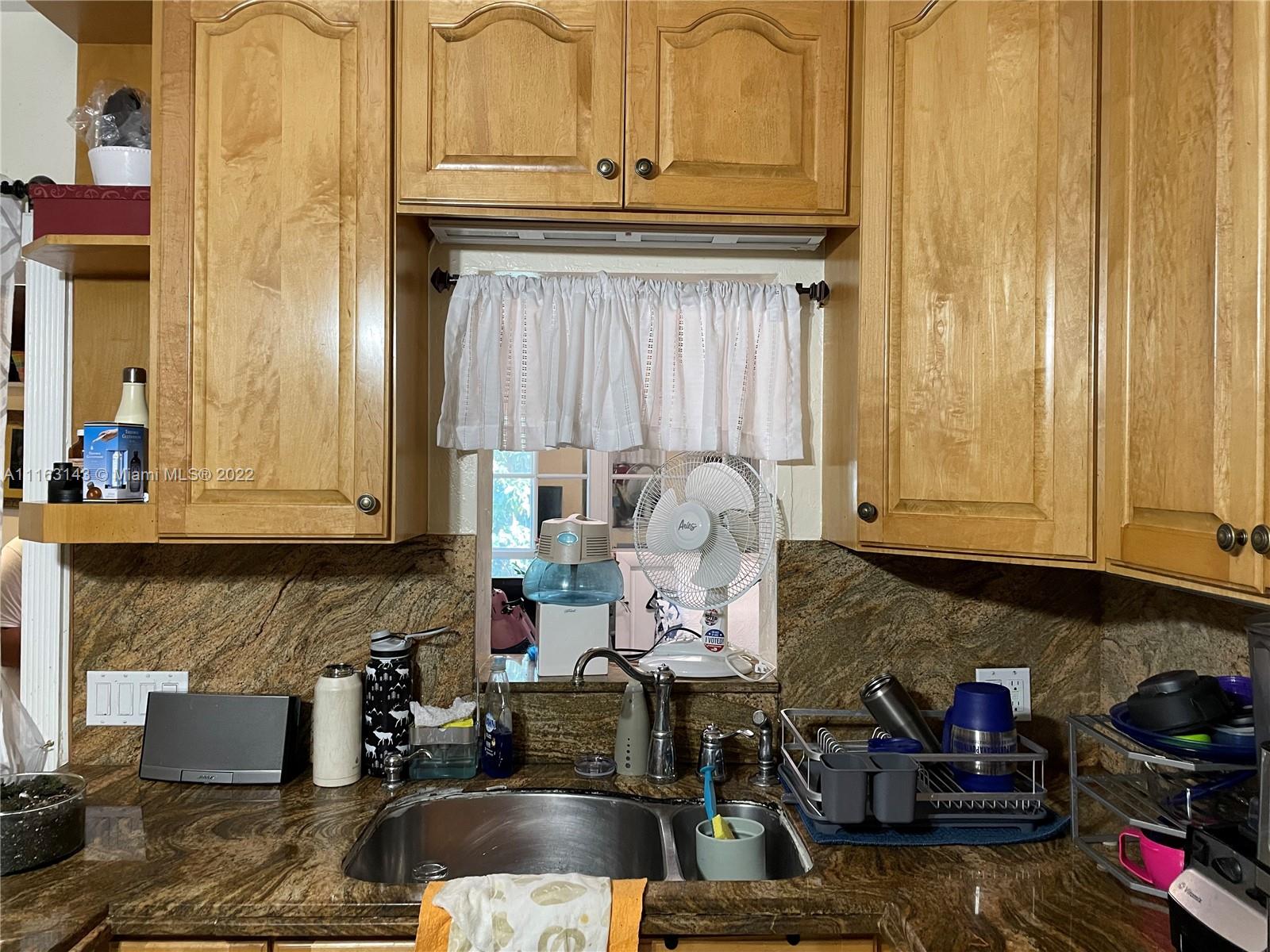 1111 Southwest 11th Avenue Miami, FL 33129 - Photo 15 of 28 a kitchen with stove and cabinets