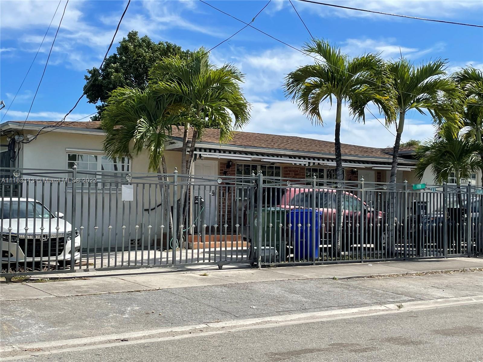 1111 Southwest 11th Avenue Miami, FL 33129 - Photo 2 of 28 a view of a house with a iron fence