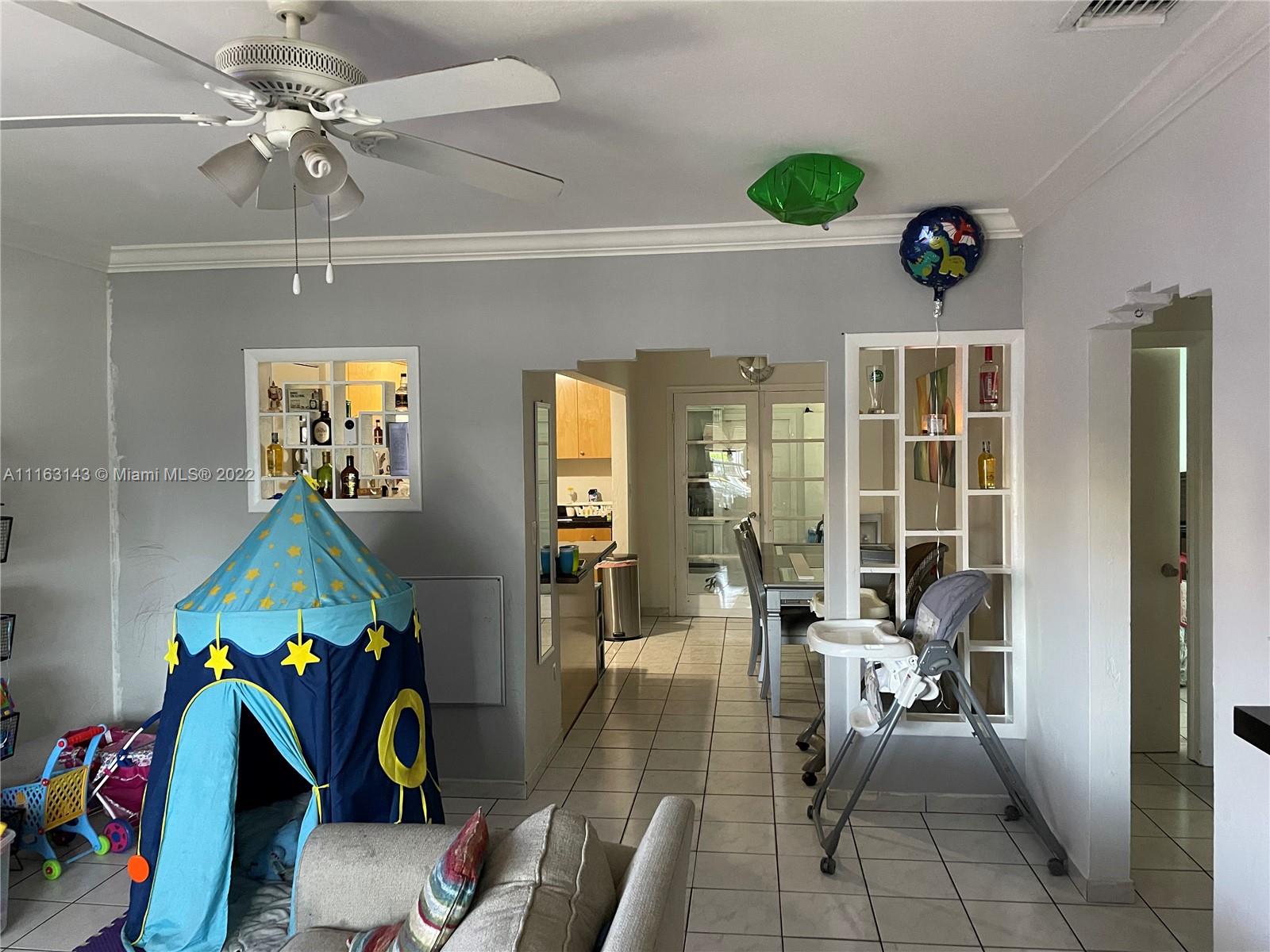 1111 Southwest 11th Avenue Miami, FL 33129 - Photo 21 of 28 a view of a dining room with furniture and chandelier