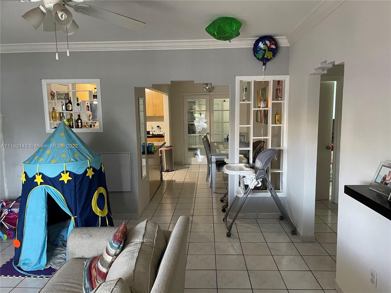 1111 Southwest 11th Avenue Miami, FL 33129 - Photo 22 of 28 a living room filled with furniture and a table
