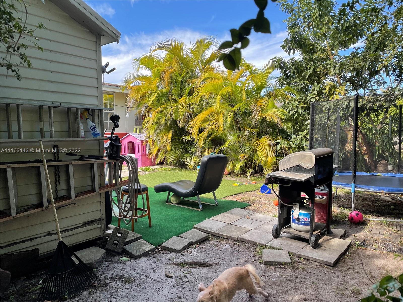 1111 Southwest 11th Avenue Miami, FL 33129 - Photo 28 of 28 a view of a patio with a table and chairs