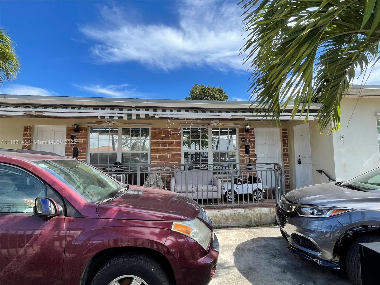 1111 Southwest 11th Avenue Miami, FL 33129 - Photo 3 of 28 a front view of house with outdoor seating
