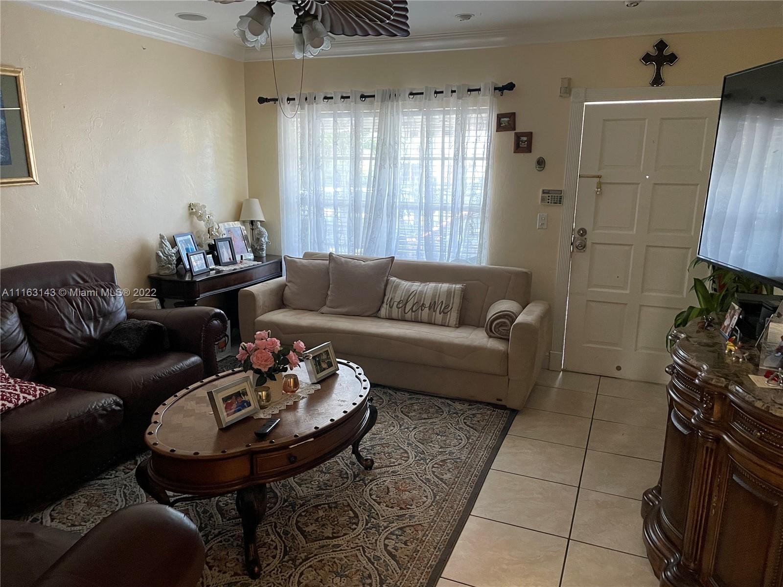 1111 Southwest 11th Avenue Miami, FL 33129 - Photo 10 of 28 a living room with furniture and a fireplace