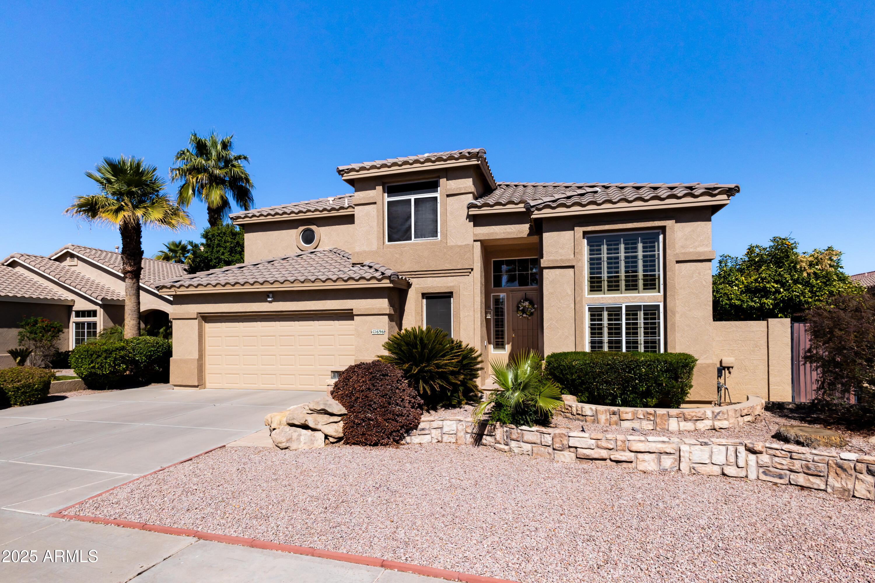 696 West Del Rio Street Gilbert, AZ 85233 - Photo 1 of 39 a house view with a garden space