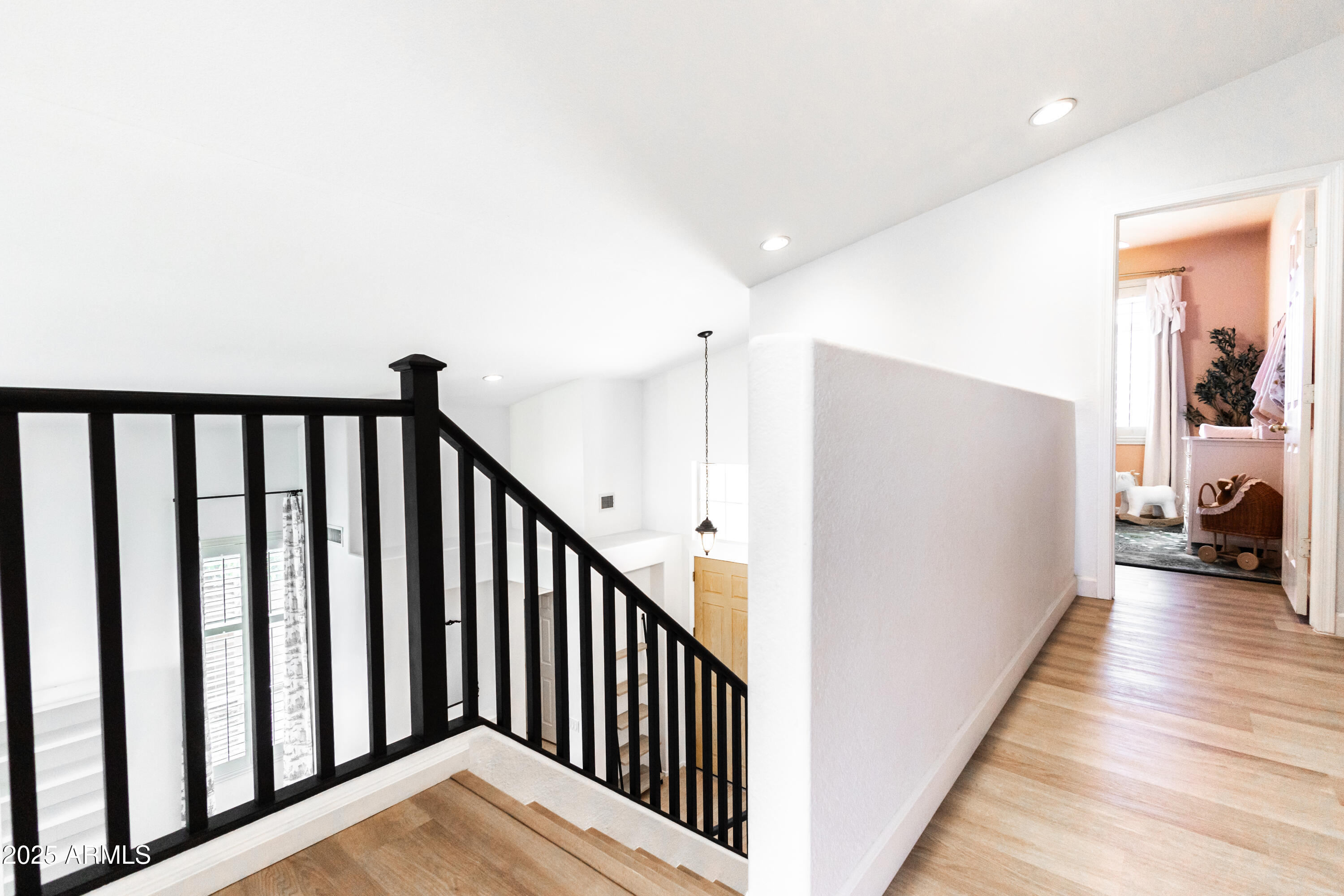 696 West Del Rio Street Gilbert, AZ 85233 - Photo 17 of 39 a view of a hallway with wooden floor and staircase