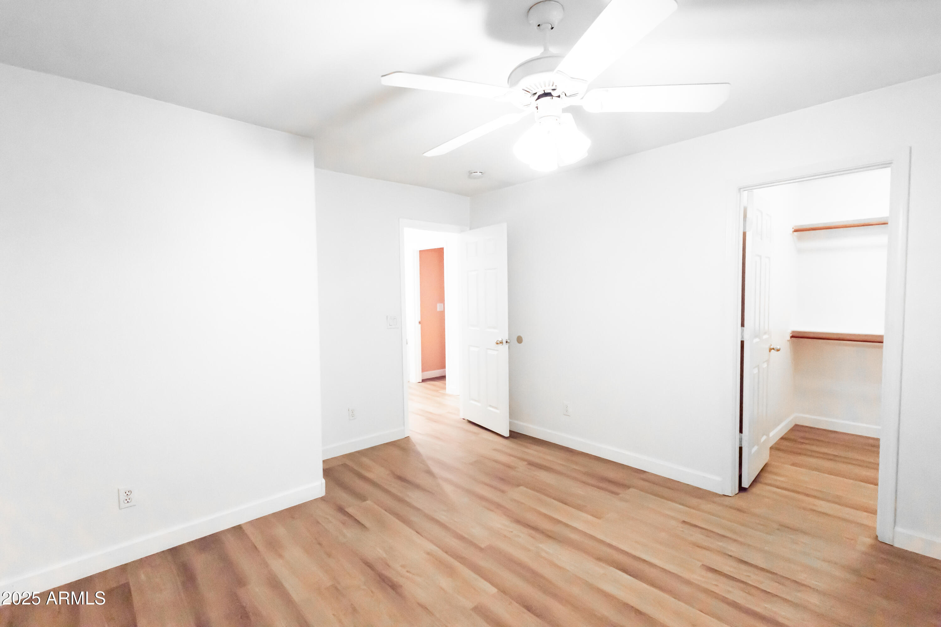 696 West Del Rio Street Gilbert, AZ 85233 - Photo 20 of 39 a view of an empty room with wooden floor