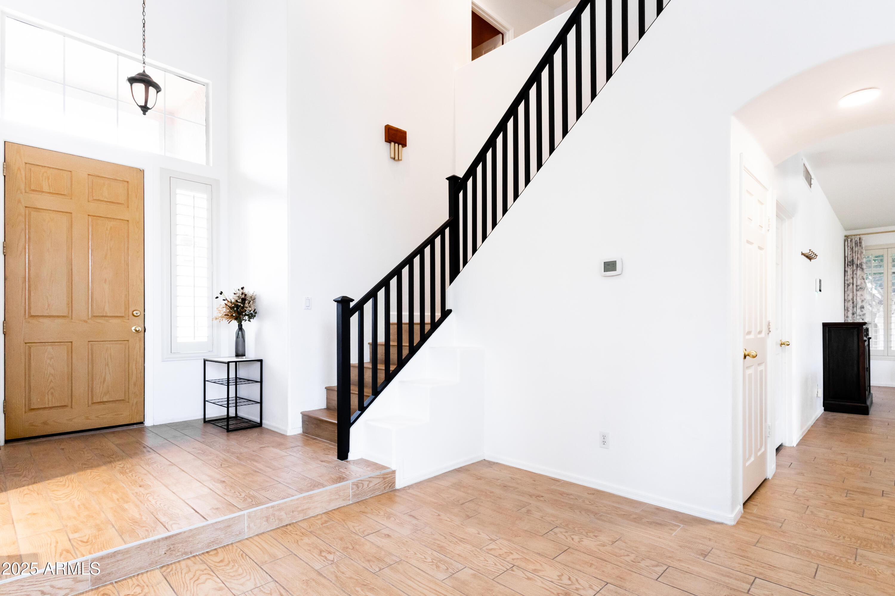 696 West Del Rio Street Gilbert, AZ 85233 - Photo 2 of 39 a view of a hallway view with staircase