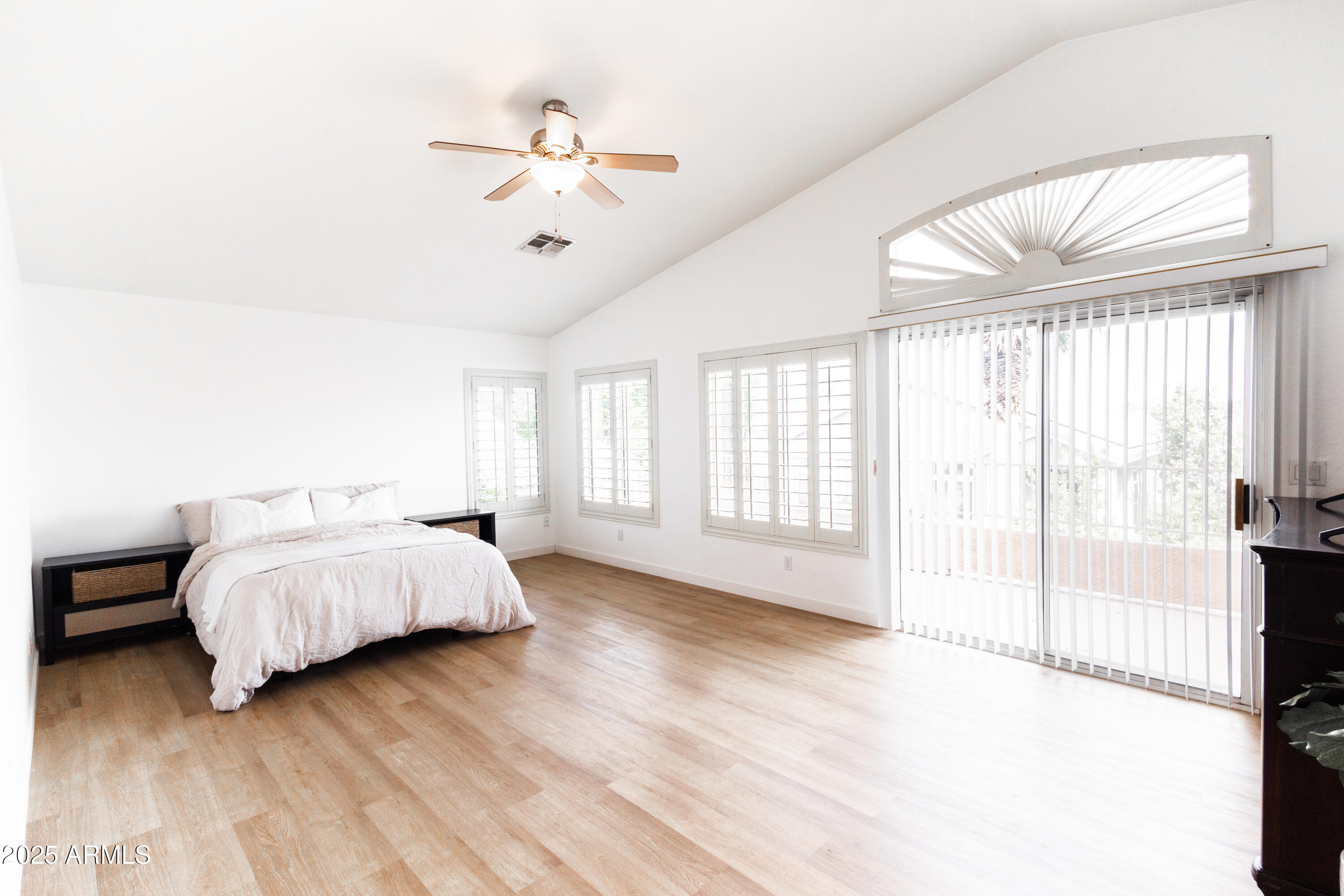 696 West Del Rio Street Gilbert, AZ 85233 - Photo 22 of 39 a spacious bedroom with a bed and a large window