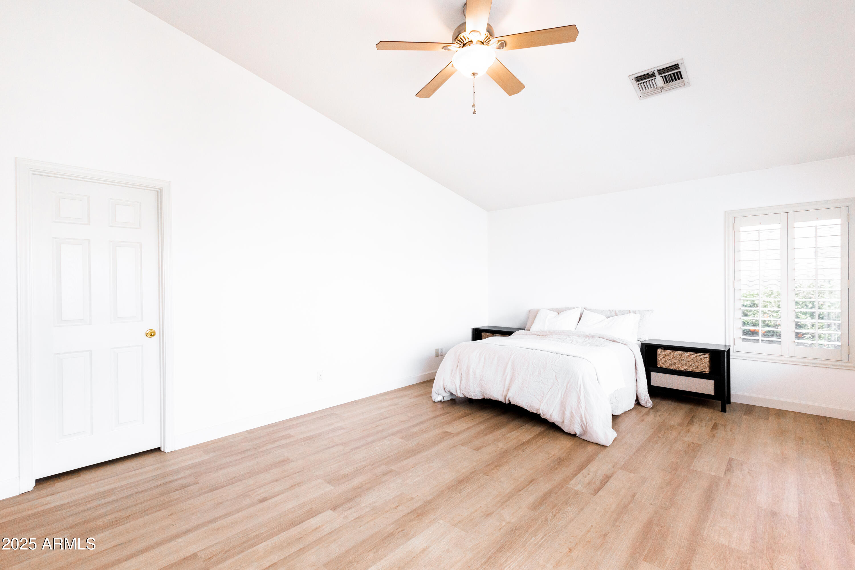696 West Del Rio Street Gilbert, AZ 85233 - Photo 23 of 39 a spacious bedroom with a bed and a window