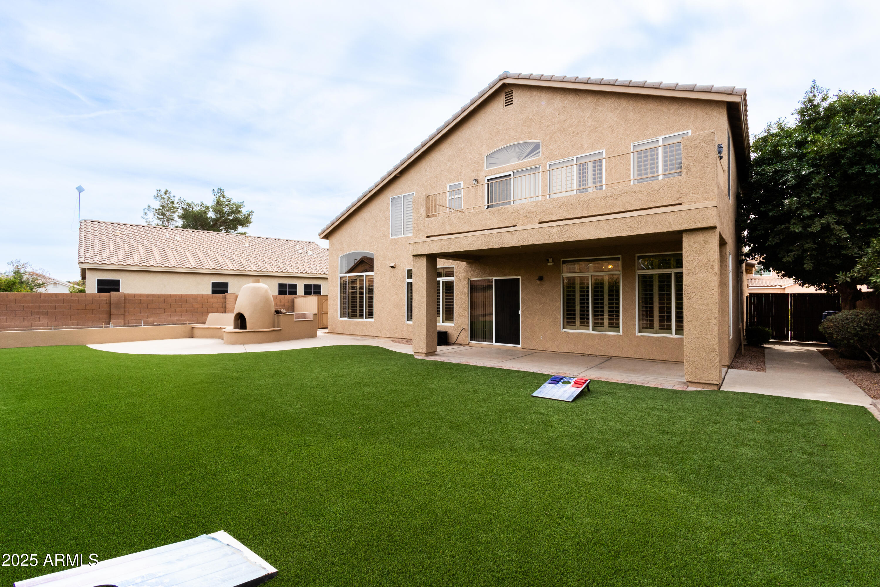 696 West Del Rio Street Gilbert, AZ 85233 - Photo 29 of 39 a view of a house with a yard and sitting area