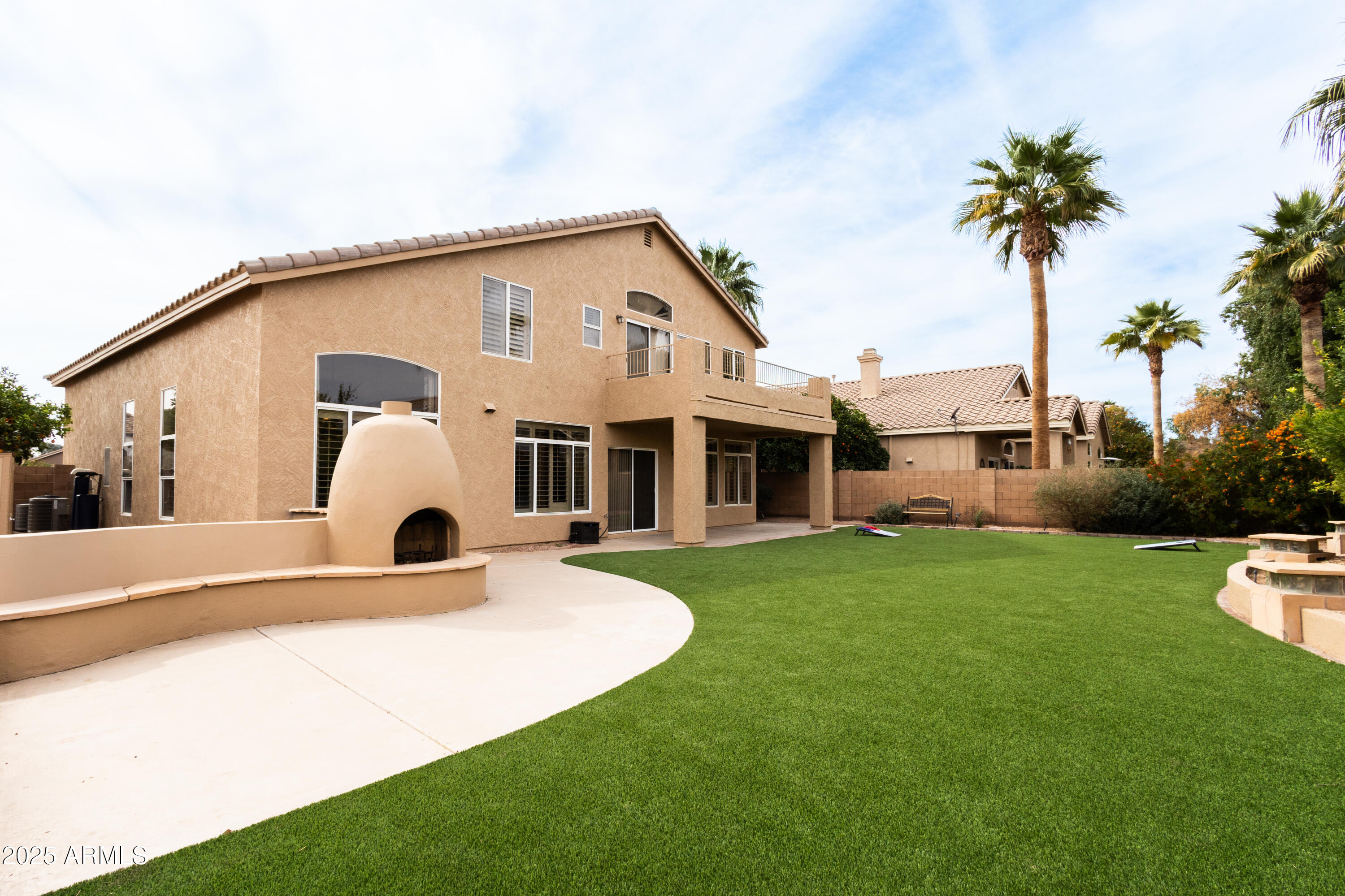 696 West Del Rio Street Gilbert, AZ 85233 - Photo 30 of 39 a view of a house with backyard and couches
