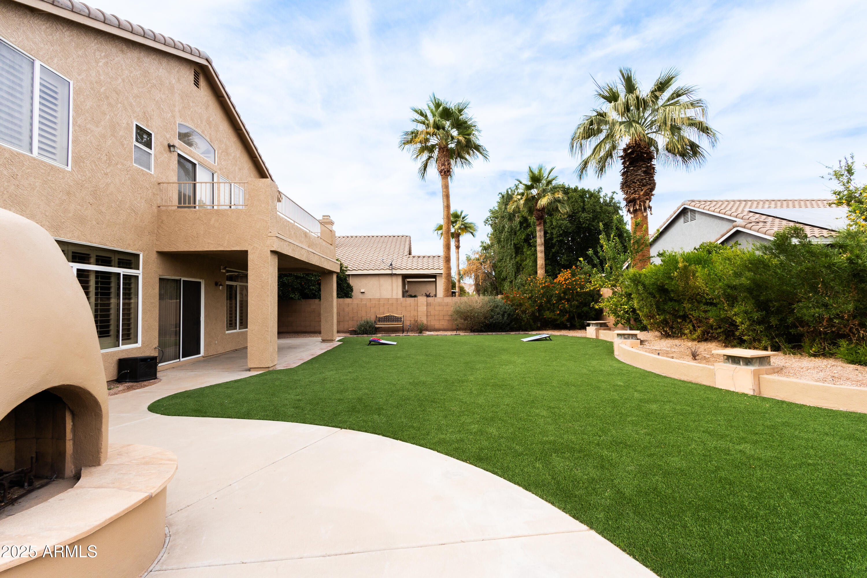696 West Del Rio Street Gilbert, AZ 85233 - Photo 31 of 39 a view of a house with a yard
