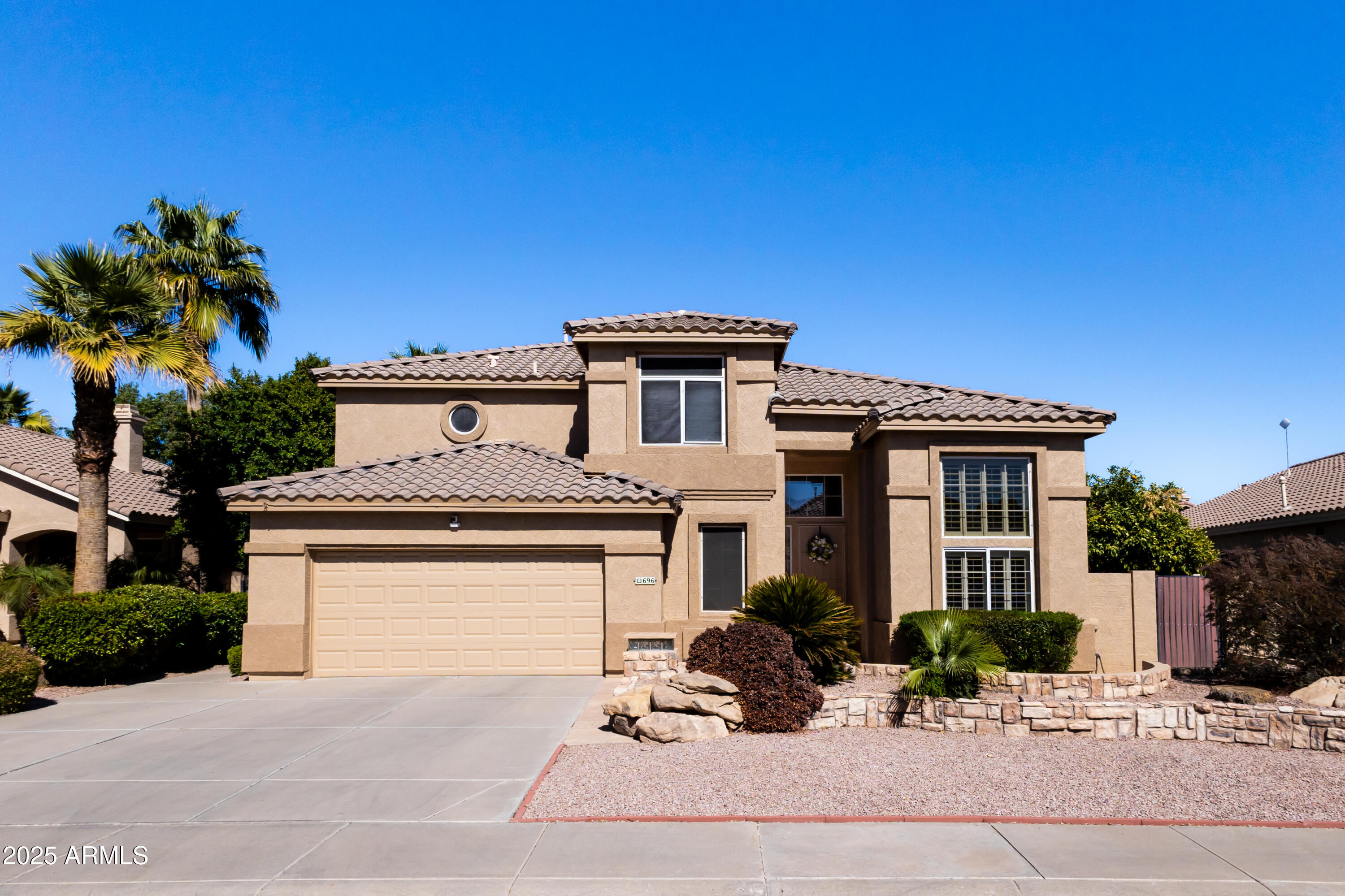 696 West Del Rio Street Gilbert, AZ 85233 - Photo 39 of 39 a front view of a house with a yard