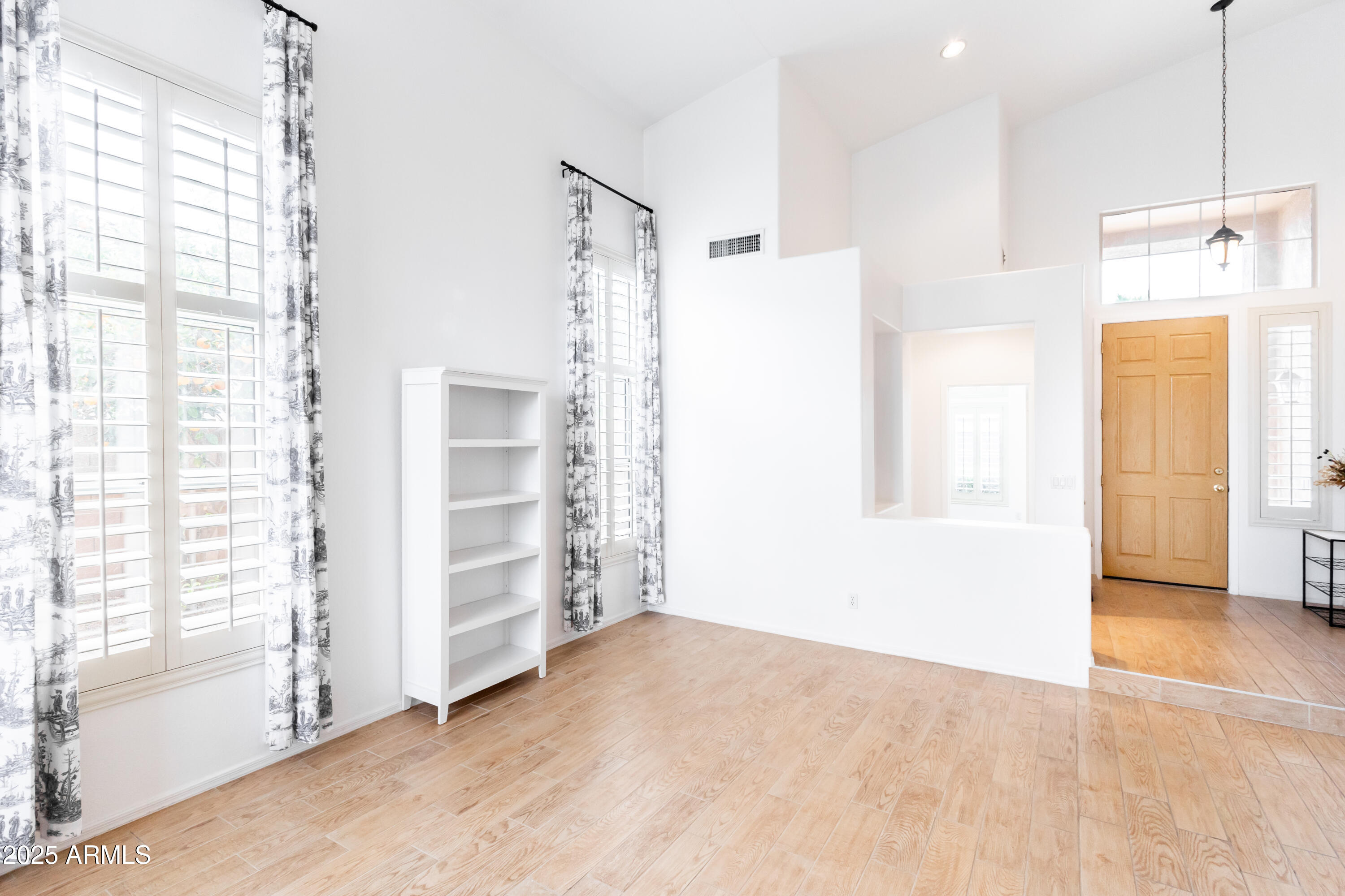 696 West Del Rio Street Gilbert, AZ 85233 - Photo 4 of 39 a view of an empty room with a window