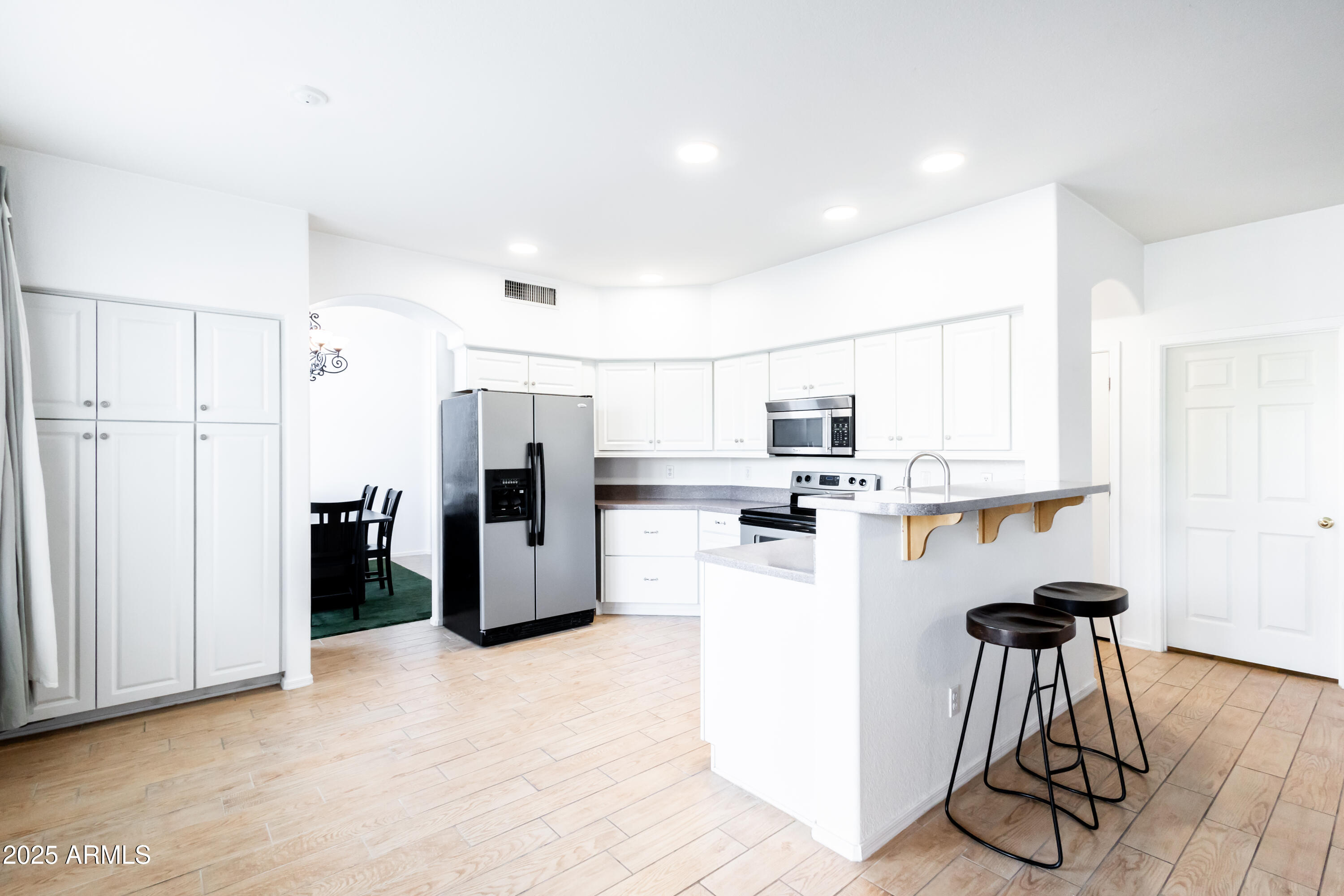 696 West Del Rio Street Gilbert, AZ 85233 - Photo 7 of 39 a kitchen with refrigerator and microwave
