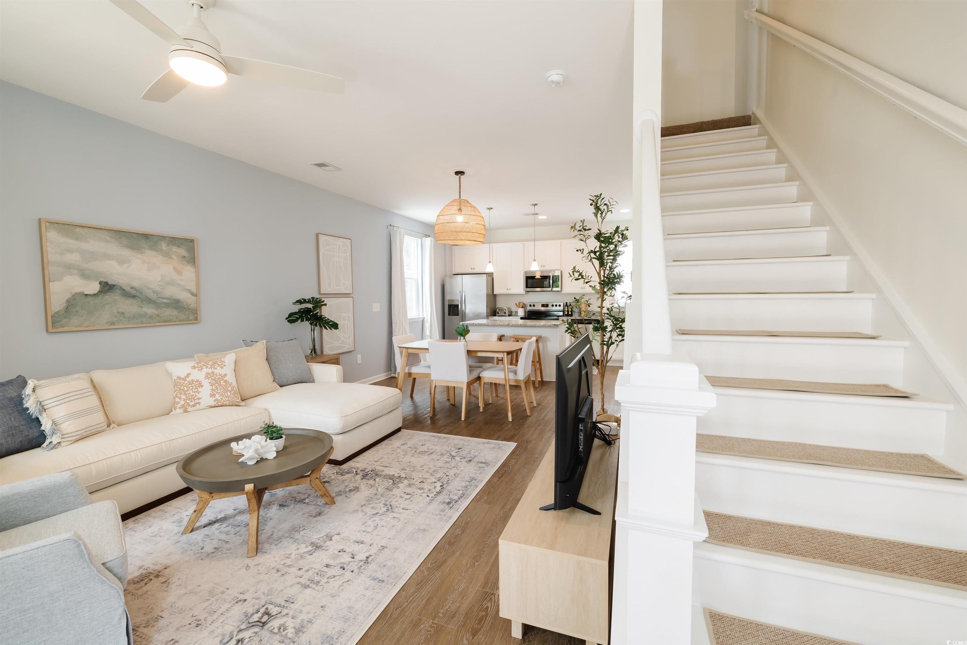 3553 Ladybank Loop Myrtle Beach, SC 29577 - Photo 3 of 30 Living room with stairs, wood finished floors, and