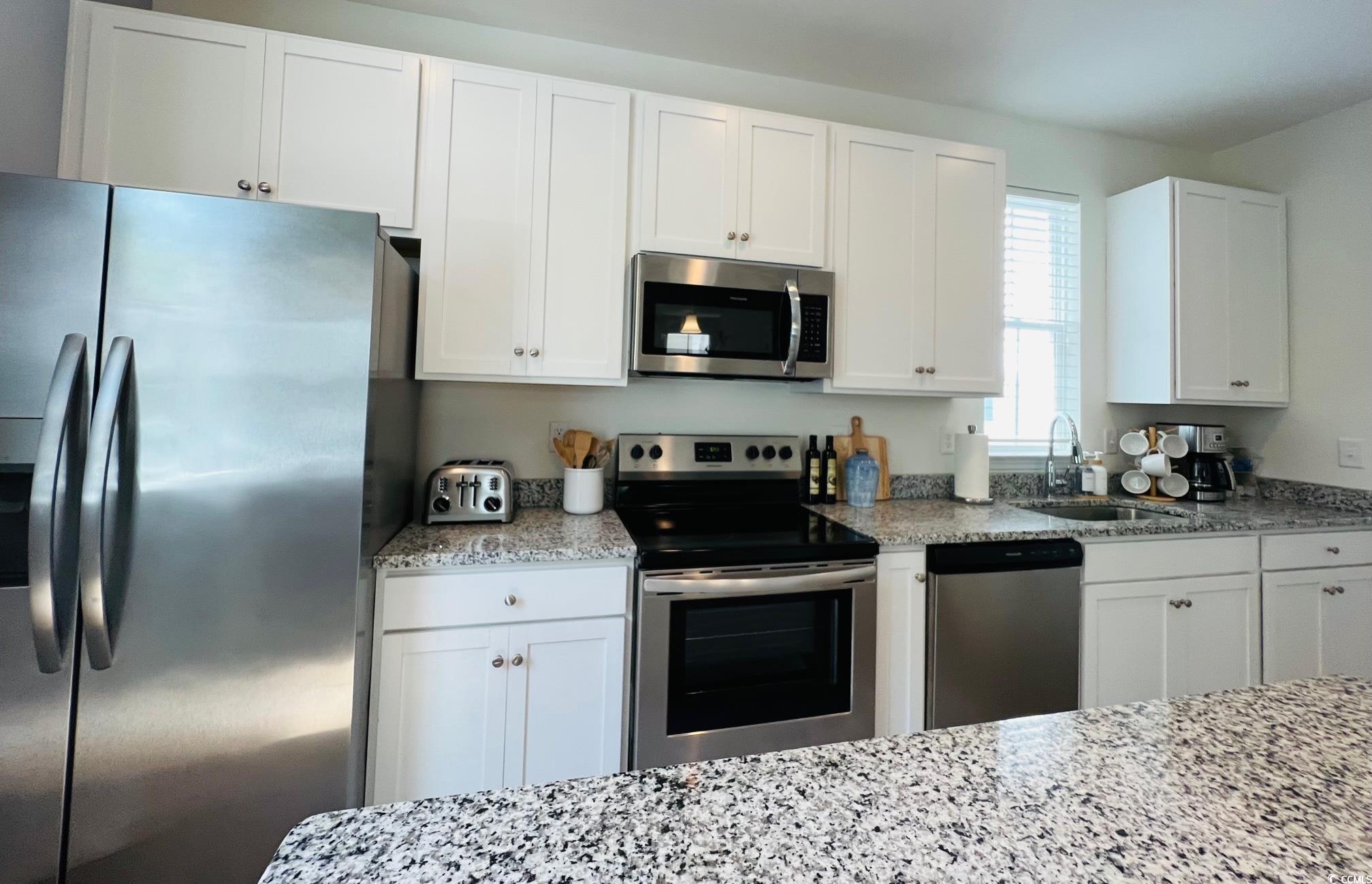 3553 Ladybank Loop Myrtle Beach, SC 29577 - Photo 5 of 30 Kitchen featuring stainless steel appliances, whit
