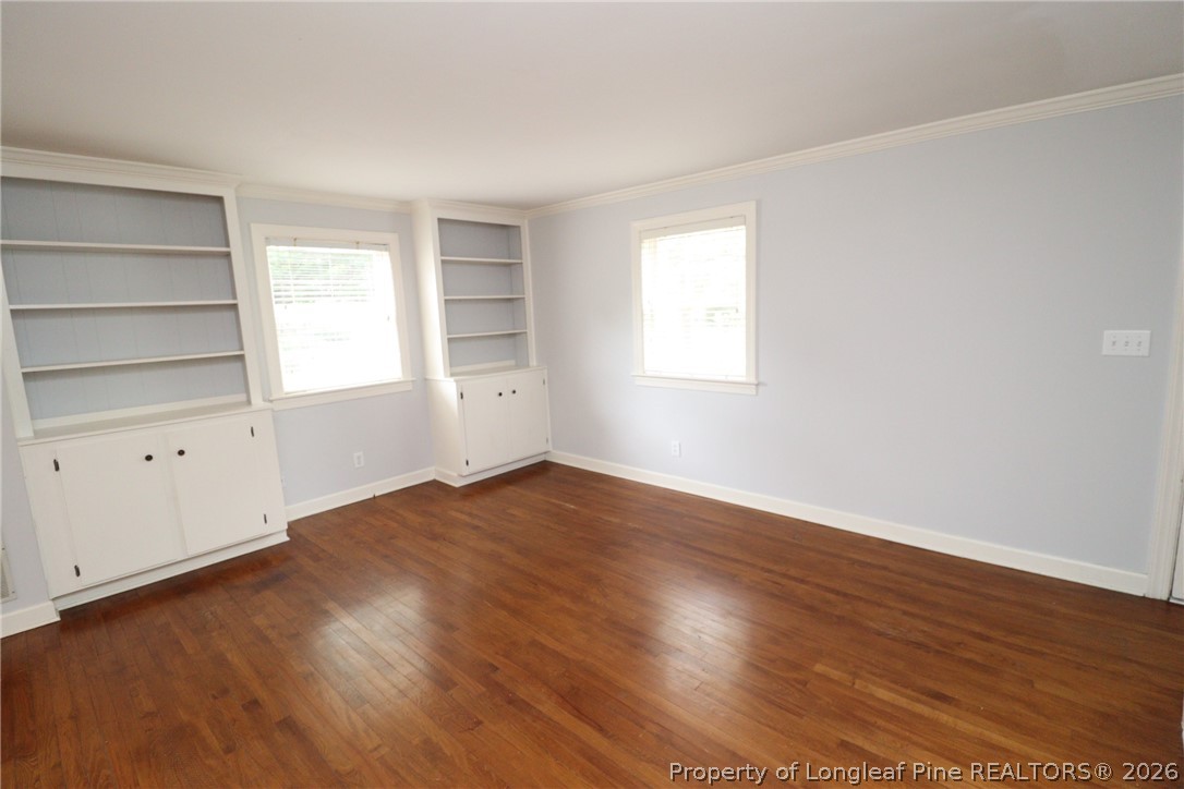 1000 Nichols Drive Raleigh, NC 27605 - Photo 3 of 22 an empty room with wooden floor and window