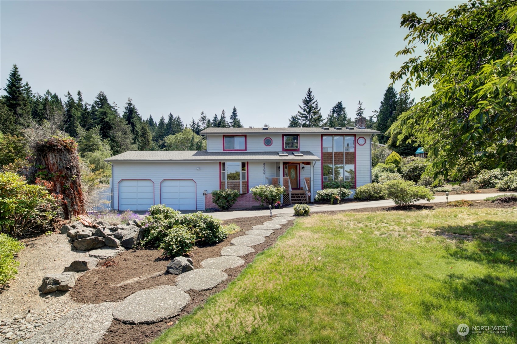 8500 Talbot Road Edmonds, WA 98026 - Photo 1 of 30 a front view of a house with a yard