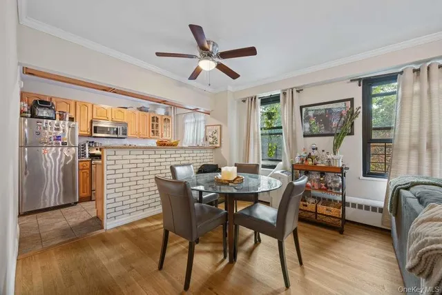 a dining room with furniture and window