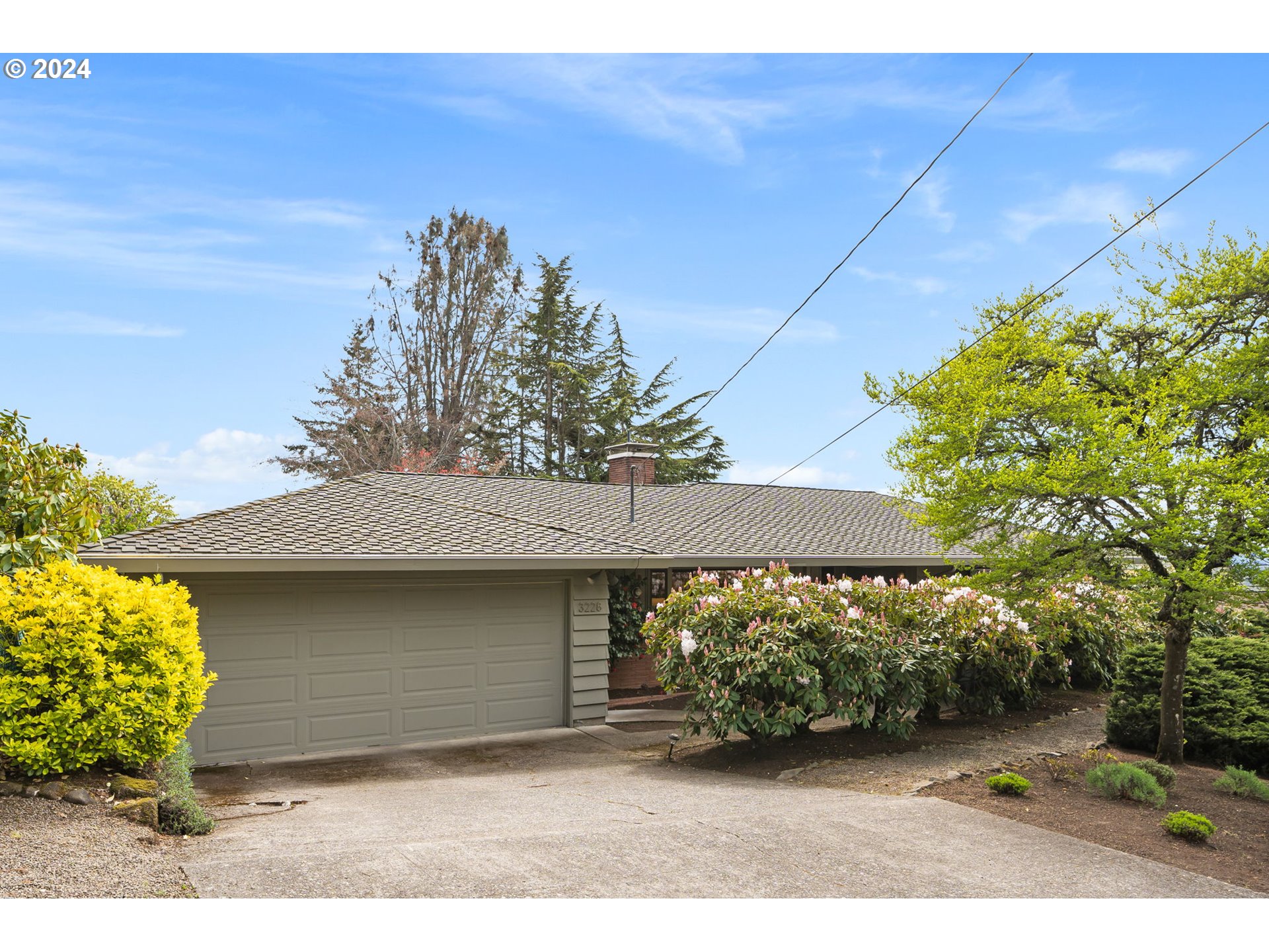 3228 Southwest Hamilton Street Portland, OR 97239 - Photo 1 of 46 a front view of a house with a yard