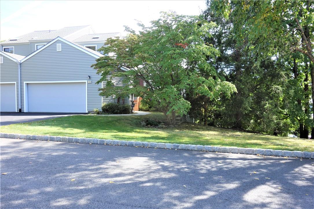Spacial end unit with a 2 car garage in a prime location at Fox Hill