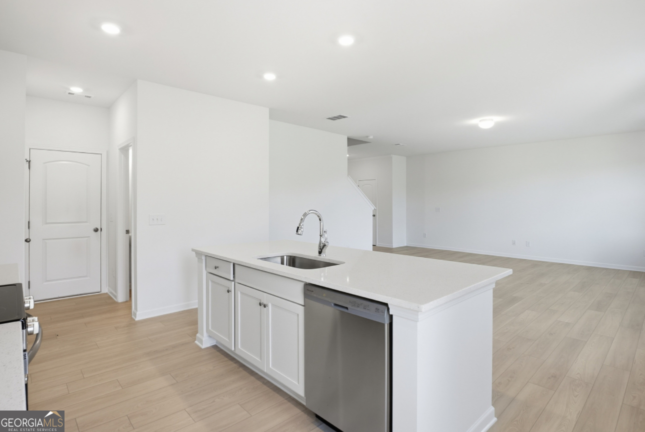 32 Umber Lane Newnan, GA 30263 - Photo 2 of 8 a kitchen with a sink and cabinets