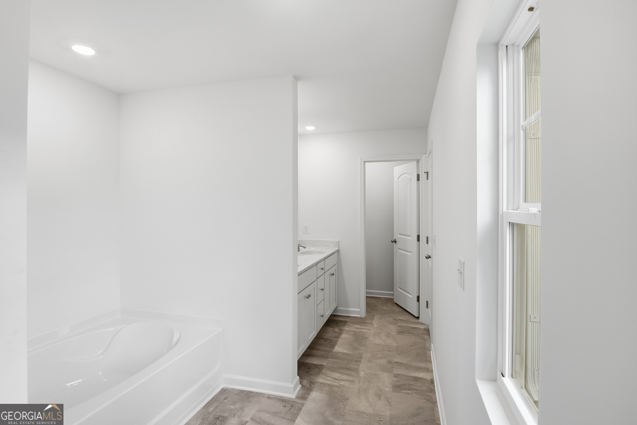 32 Umber Lane Newnan, GA 30263 - Photo 7 of 8 a bathroom with a sink and a bathtub